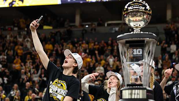 Iowa guard Caitlin Clark (22) celebrates the win after the game against Nebraska at Target Center in Minneapolis on March 10, 2024.